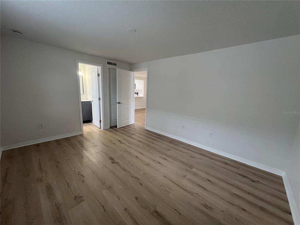 4223 Sheldon Place, Unit 23 New Port Richey, FL 34652 - Photo 10 of 13 a view of wooden floor and windows in a room