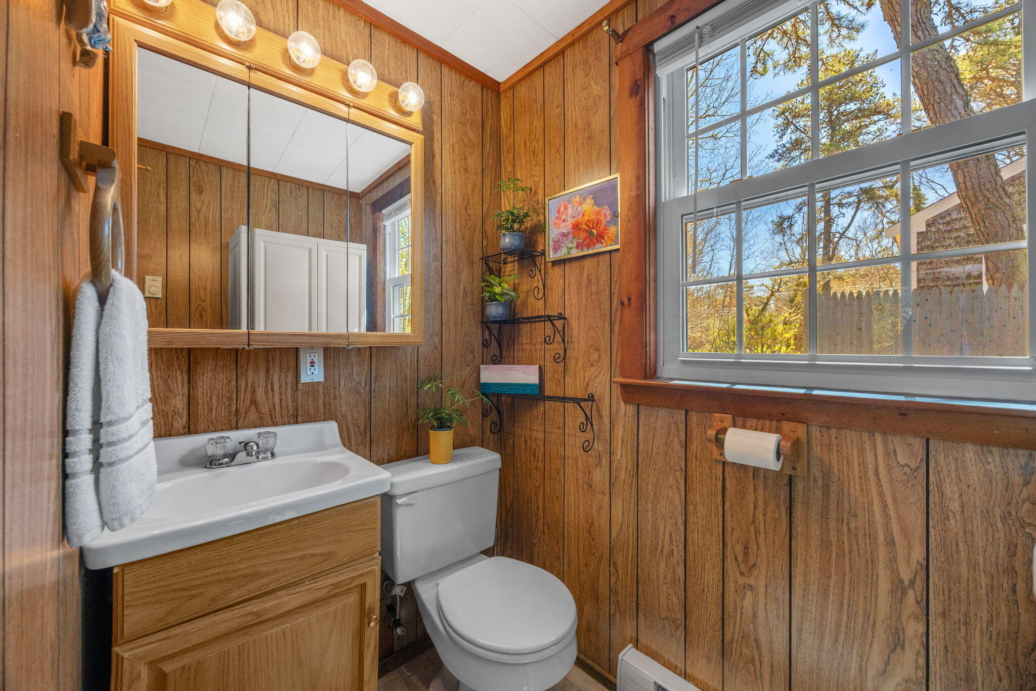 60 Long Avenue, Unit A Wellfleet, MA 02667 - Photo 15 of 28 a bathroom with a toilet a sink and a window