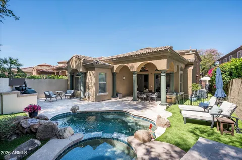 a view of a house with backyard porch and patio
