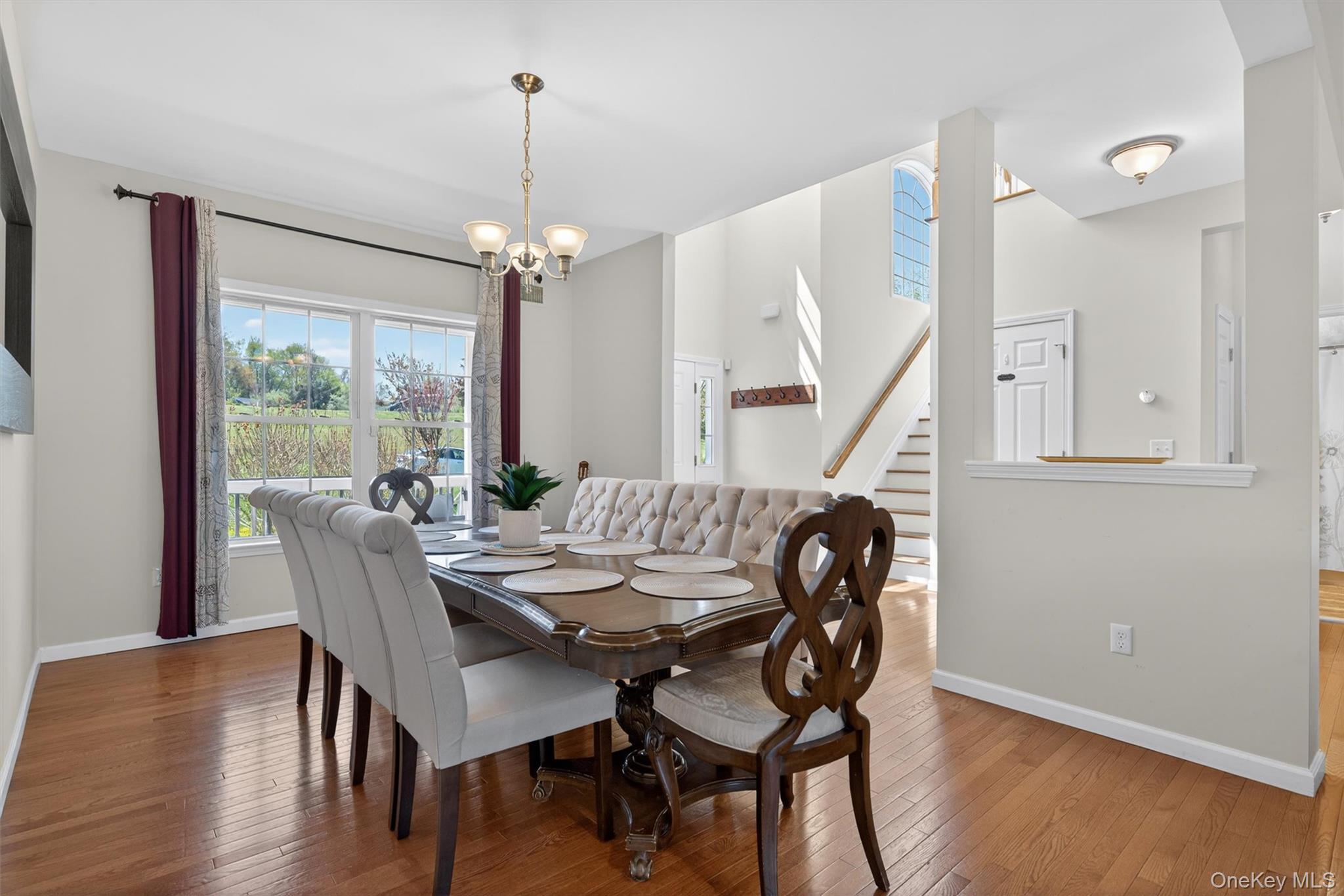 2 Primrose Lane Chester, NY 10918 - Photo 11 of 42 a dining room with furniture window entryway and wooden floor
