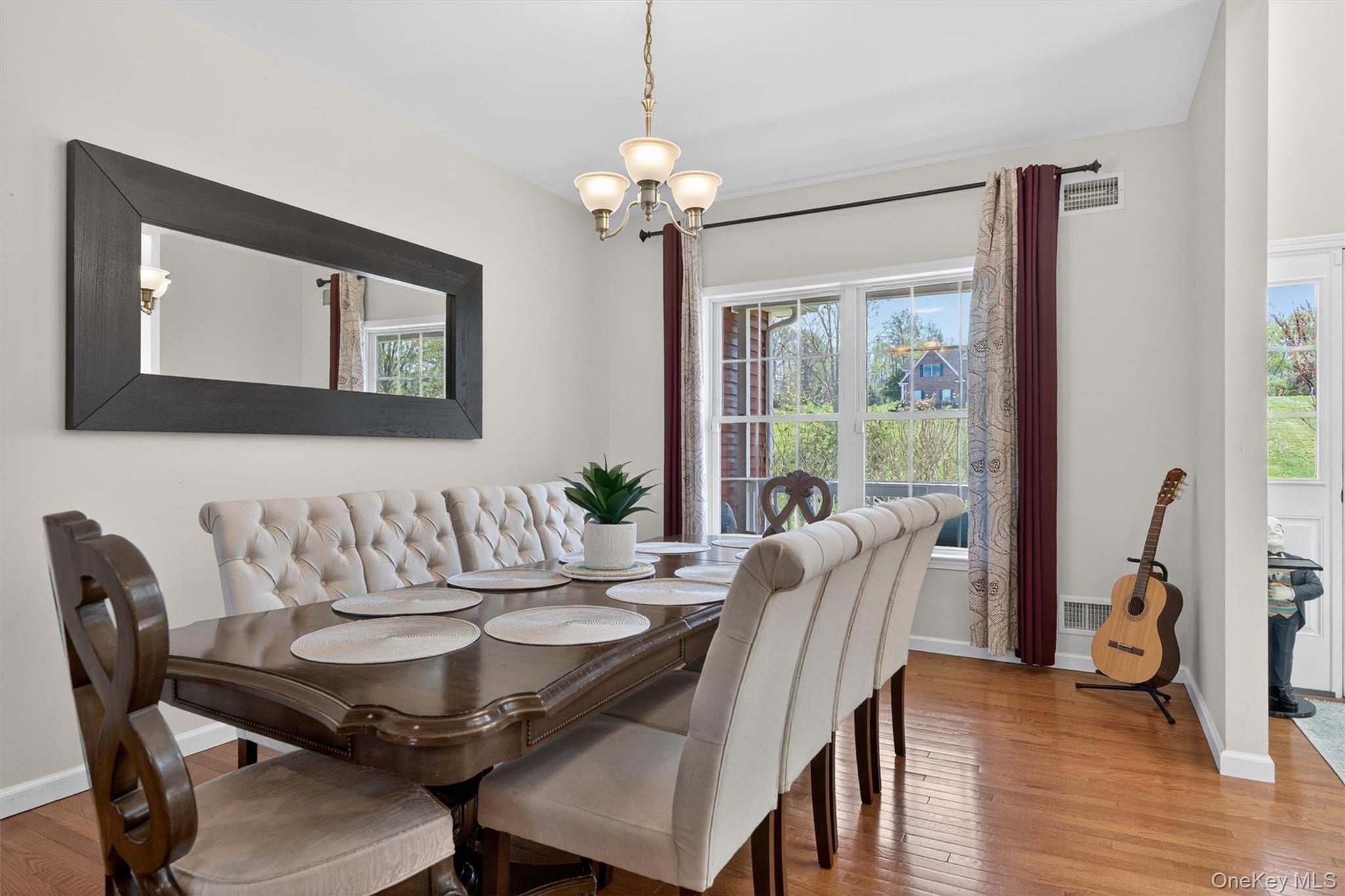 2 Primrose Lane Chester, NY 10918 - Photo 12 of 42 a view of a dining room with furniture window and wooden floor
