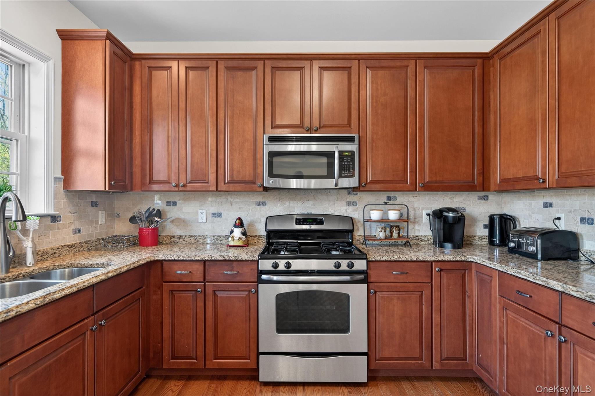 2 Primrose Lane Chester, NY 10918 - Photo 20 of 42 a kitchen with granite countertop wooden cabinets and stainless steel appliances