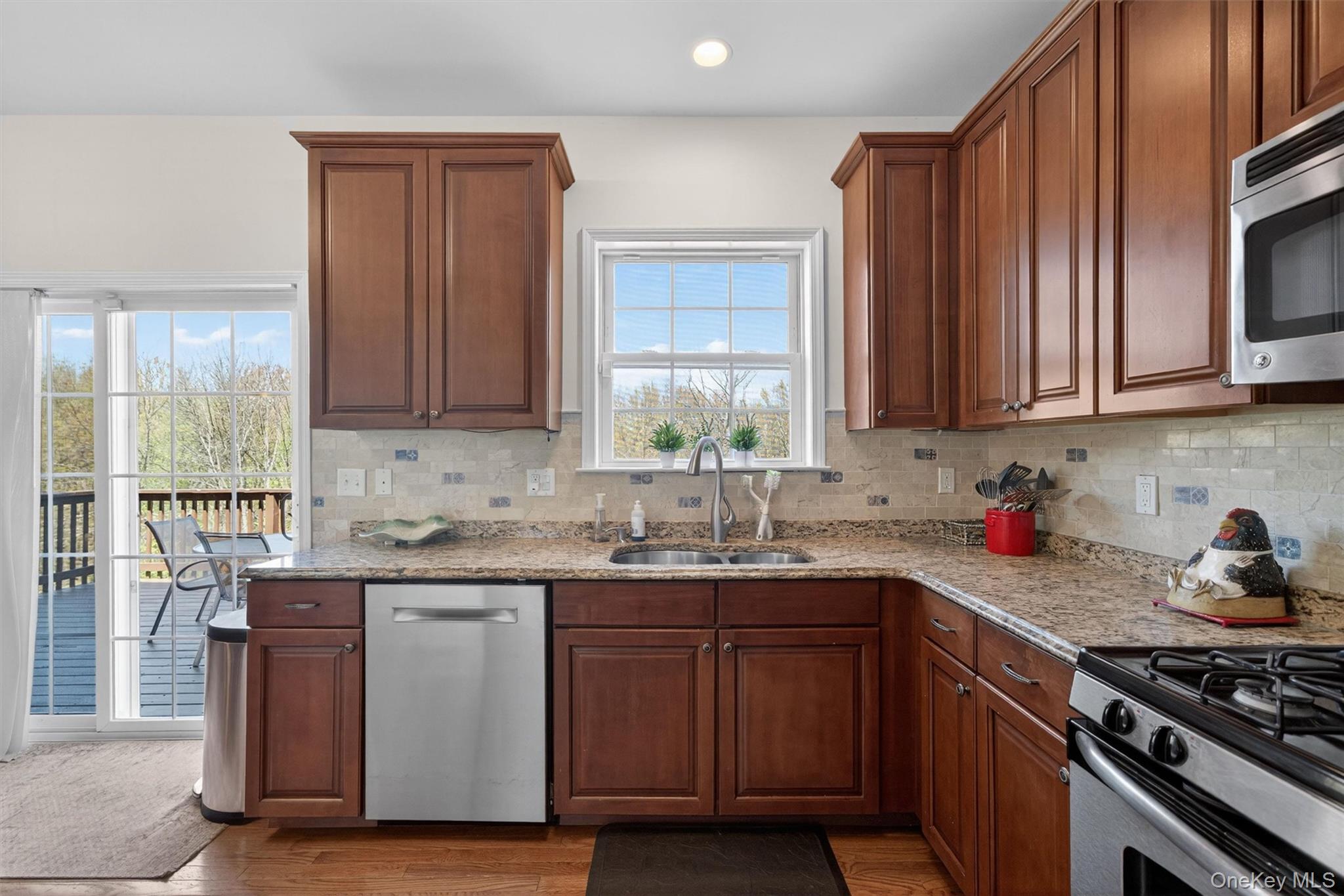 2 Primrose Lane Chester, NY 10918 - Photo 21 of 42 a kitchen with stainless steel appliances granite countertop a sink stove and cabinets
