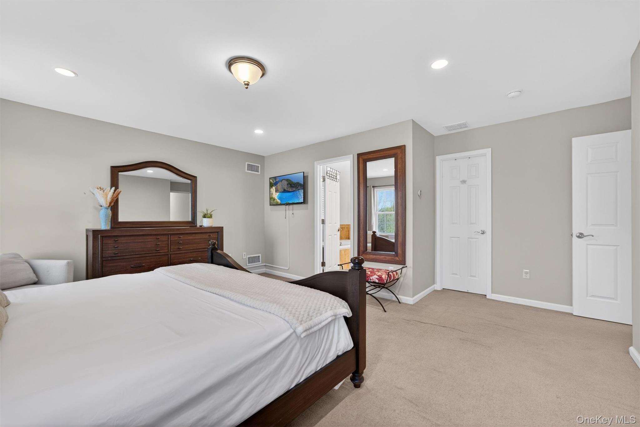 2 Primrose Lane Chester, NY 10918 - Photo 27 of 42 a bedroom with a large bed and a tv
