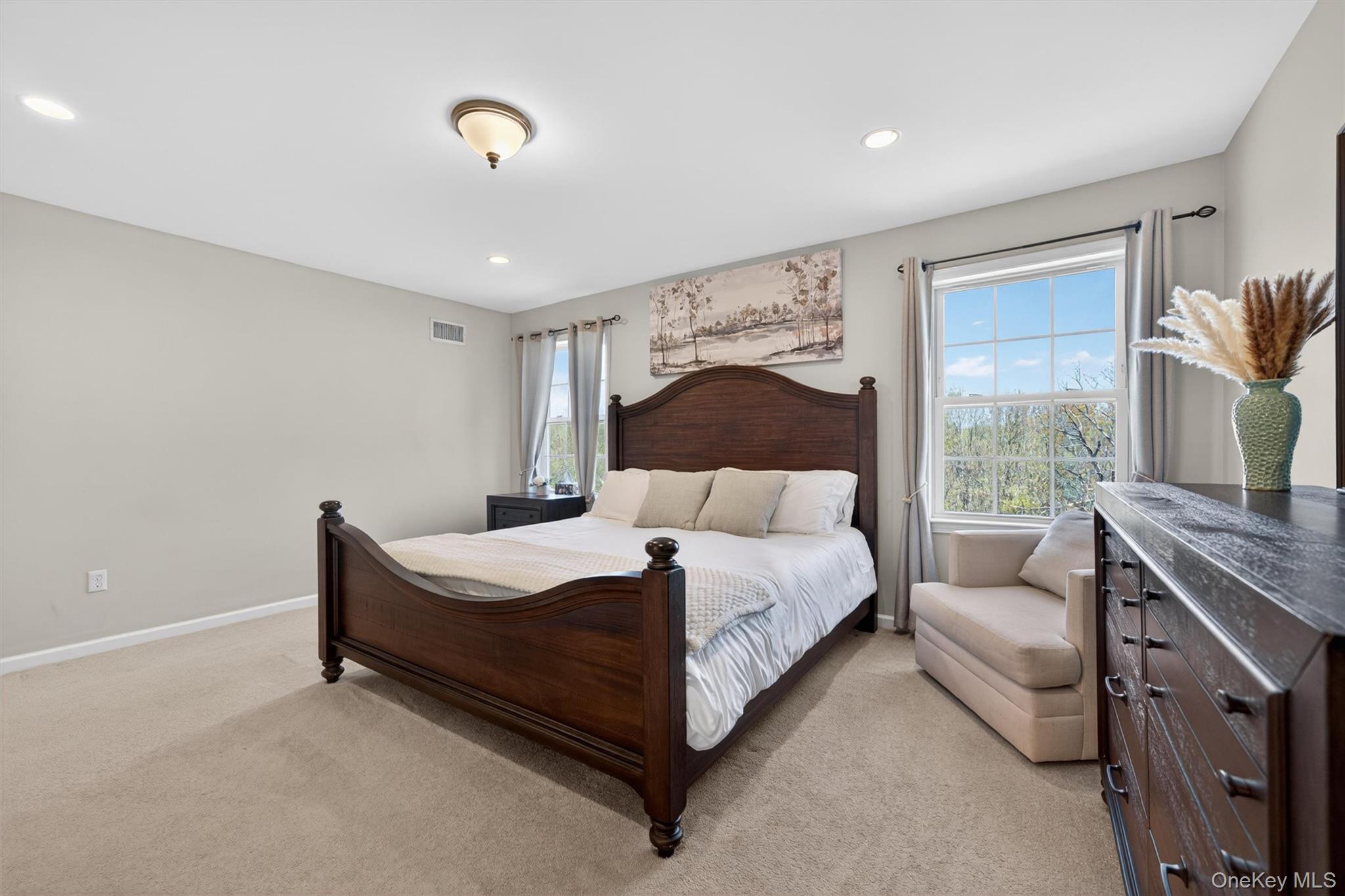 2 Primrose Lane Chester, NY 10918 - Photo 28 of 42 a spacious bedroom with a bed and a couch