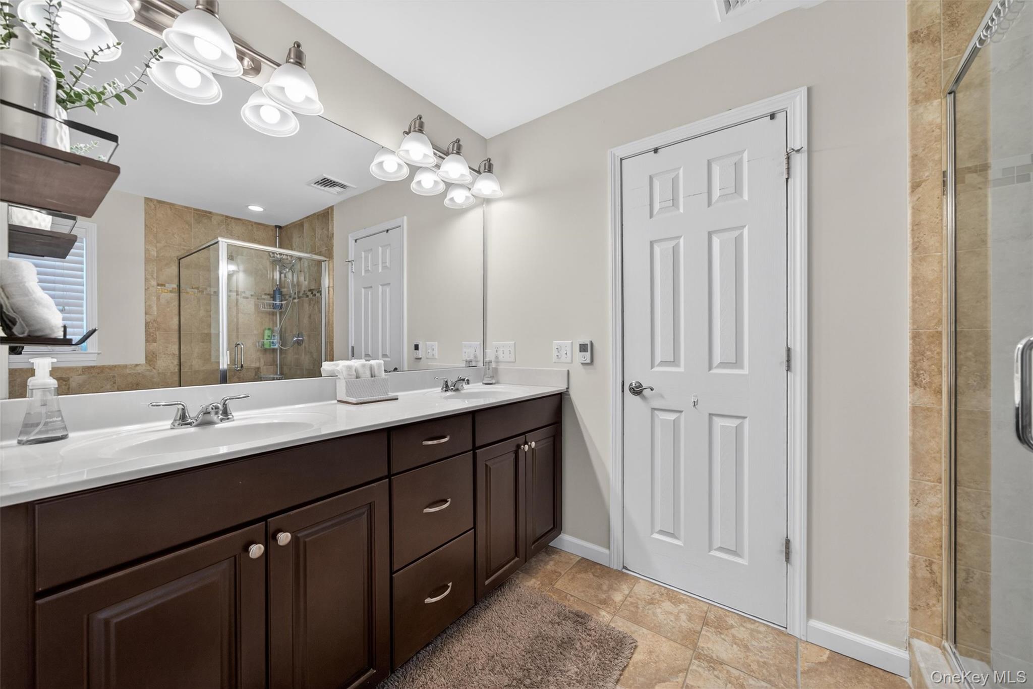 2 Primrose Lane Chester, NY 10918 - Photo 29 of 42 a bathroom with a double vanity sink mirror and