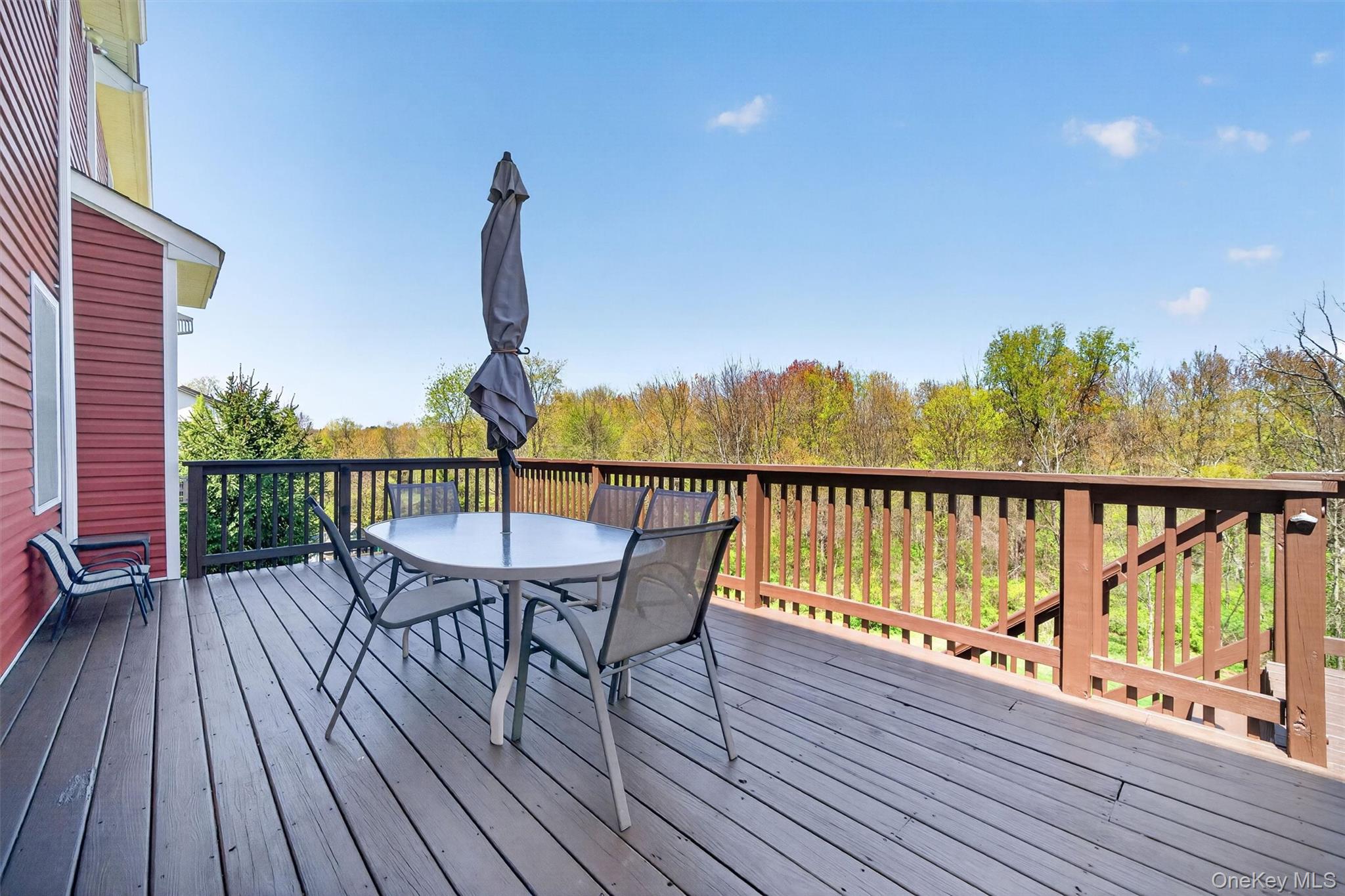 2 Primrose Lane Chester, NY 10918 - Photo 31 of 42 a view of a balcony with wooden floor and outdoor seating