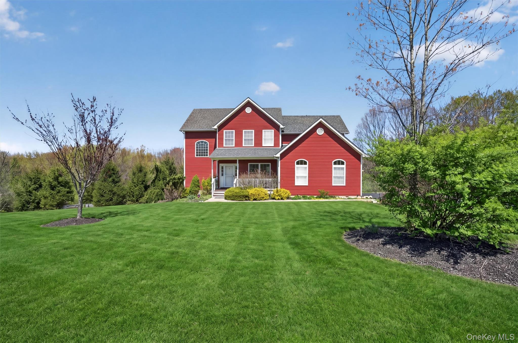2 Primrose Lane Chester, NY 10918 - Photo 4 of 42 a front view of a house with yard and green space