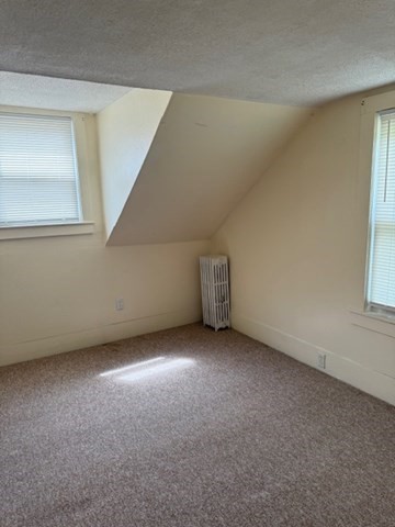 113 West Main Street, Unit 113 Ayer, MA 01432 - Photo 11 of 17 a view of an empty room with a window