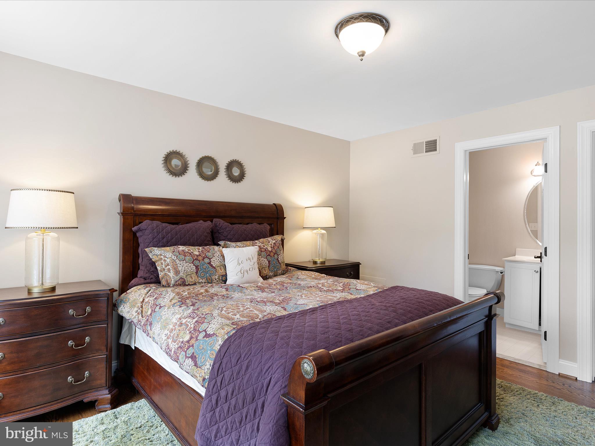 130 Waterfall Lane Landenberg, PA 19350 - Photo 32 of 49 a bedroom with a bed and a lamp on dresser