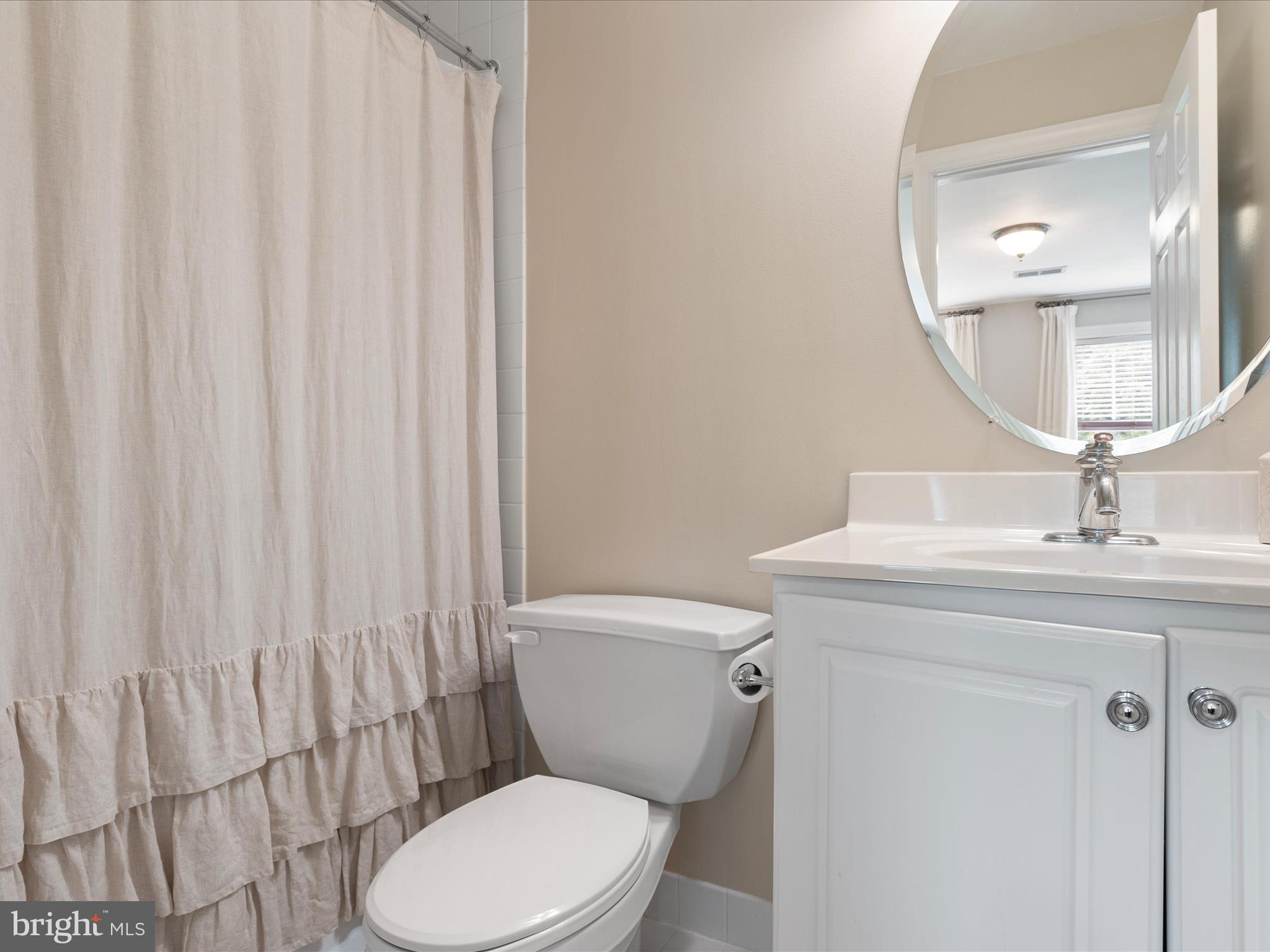 130 Waterfall Lane Landenberg, PA 19350 - Photo 33 of 49 a bathroom with a toilet a sink and a mirror