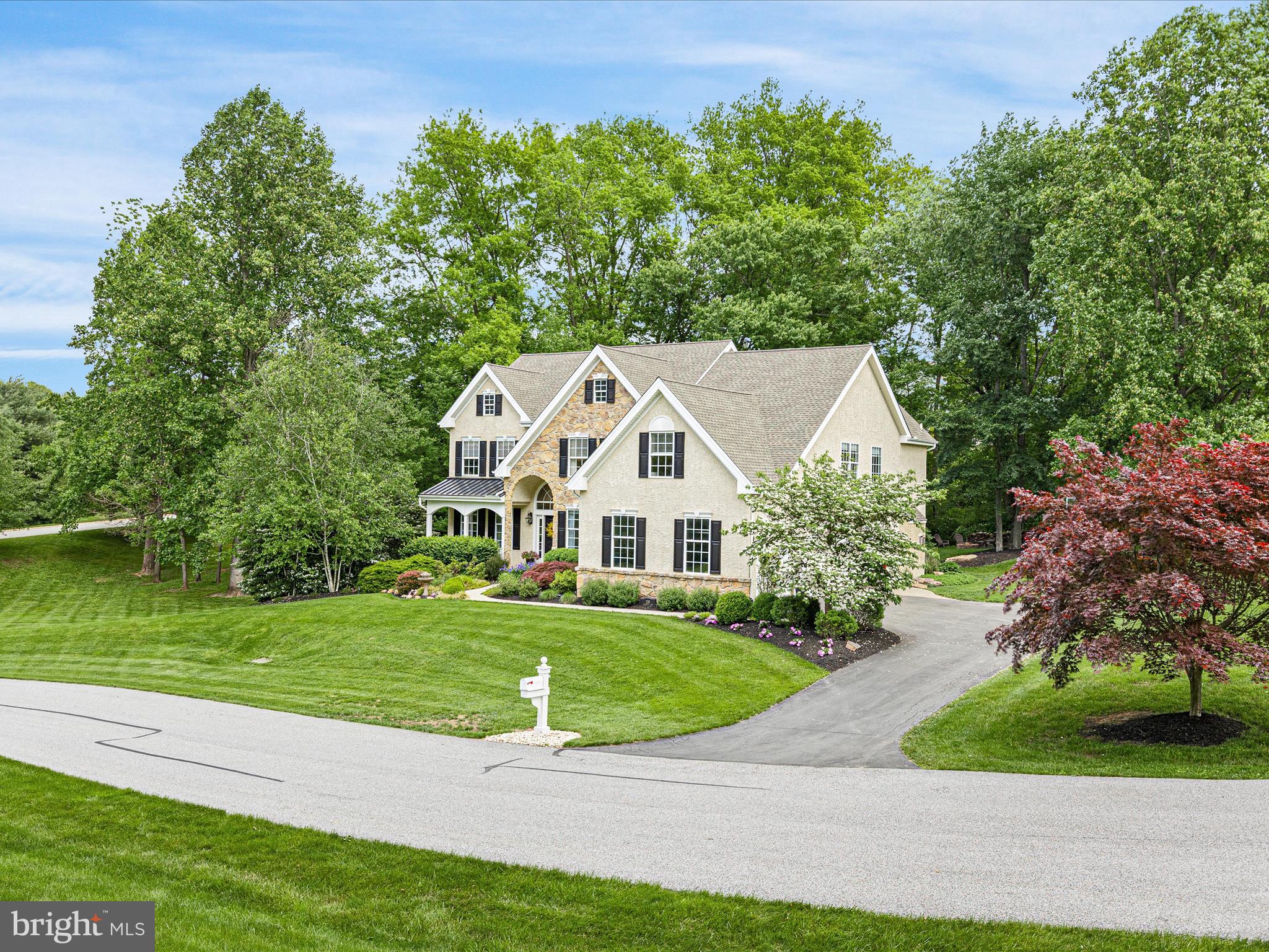 130 Waterfall Lane Landenberg, PA 19350 - Photo 41 of 49 a front view of a house with a yard and garage
