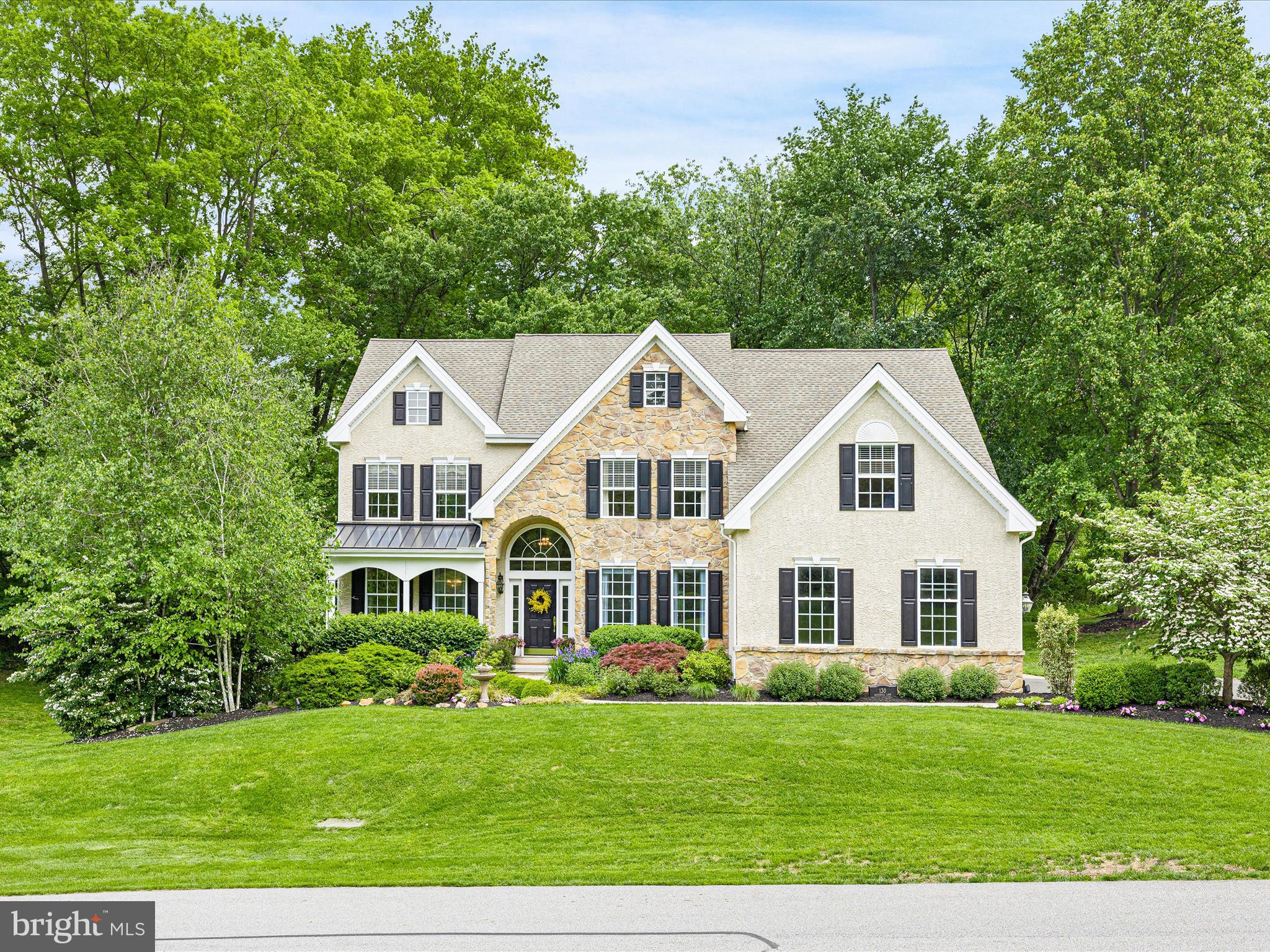130 Waterfall Lane Landenberg, PA 19350 - Photo 46 of 49 a view of a white house with a big yard and large trees