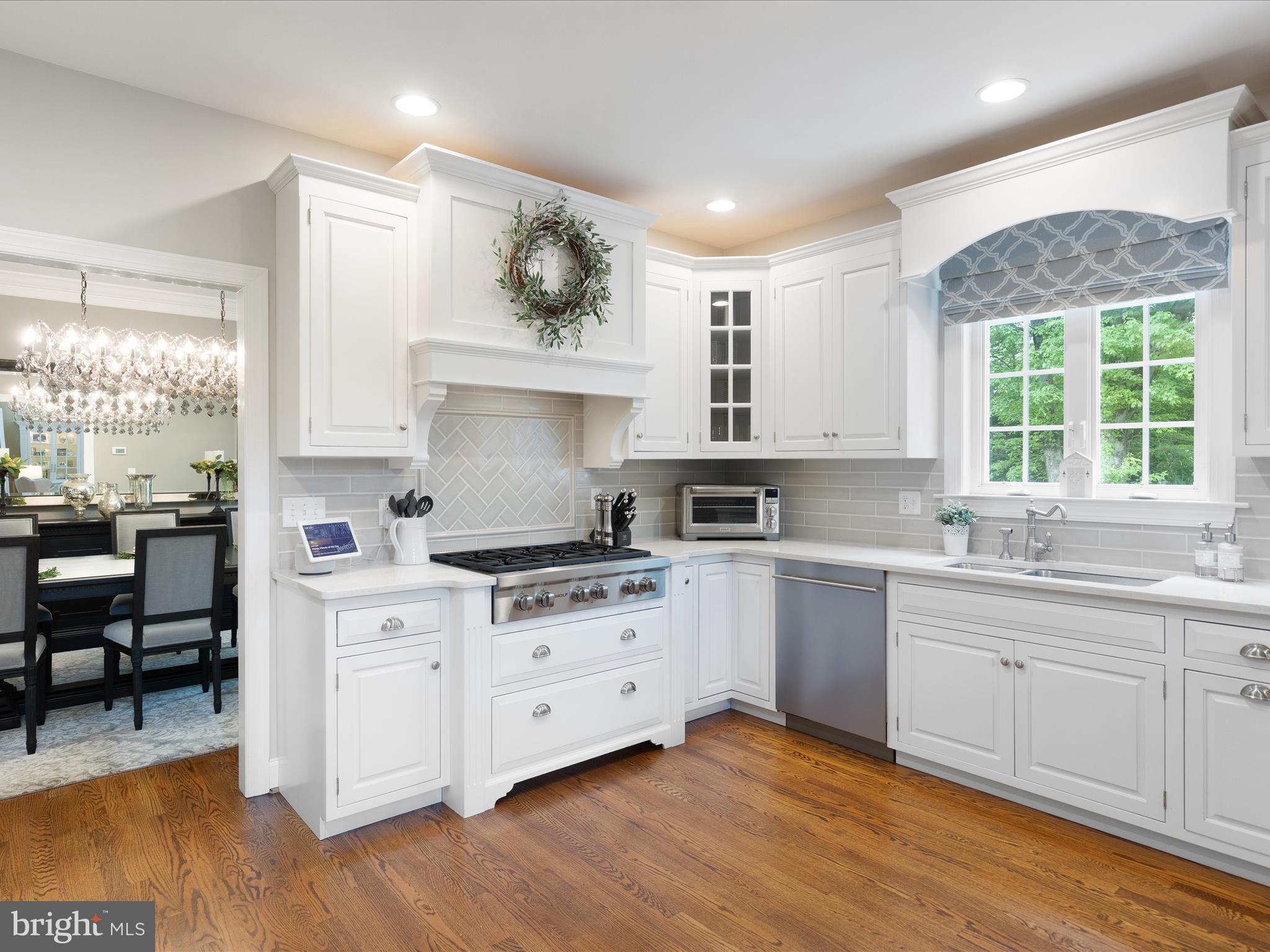 130 Waterfall Lane Landenberg, PA 19350 - Photo 10 of 49 a kitchen with a stove a sink and white cabinets