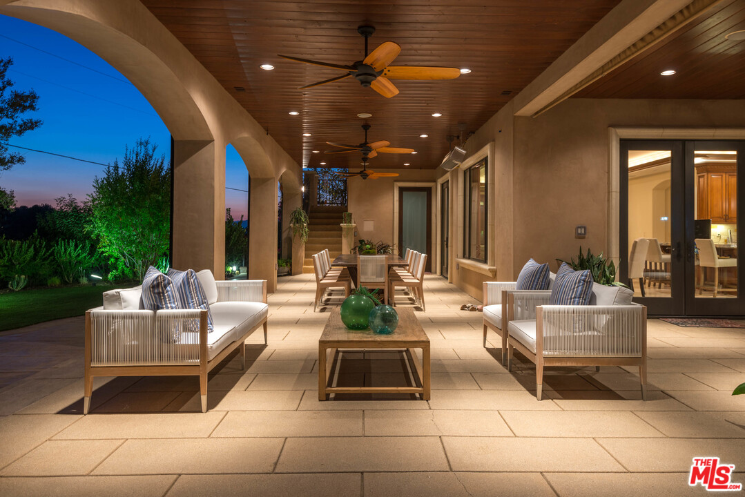 4775 Topeka Drive Tarzana, CA 91356 - Photo 15 of 19 a living room with furniture and a potted plant