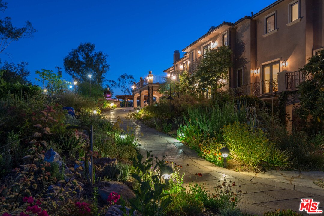 4775 Topeka Drive Tarzana, CA 91356 - Photo 17 of 19 a view of a house and a yard