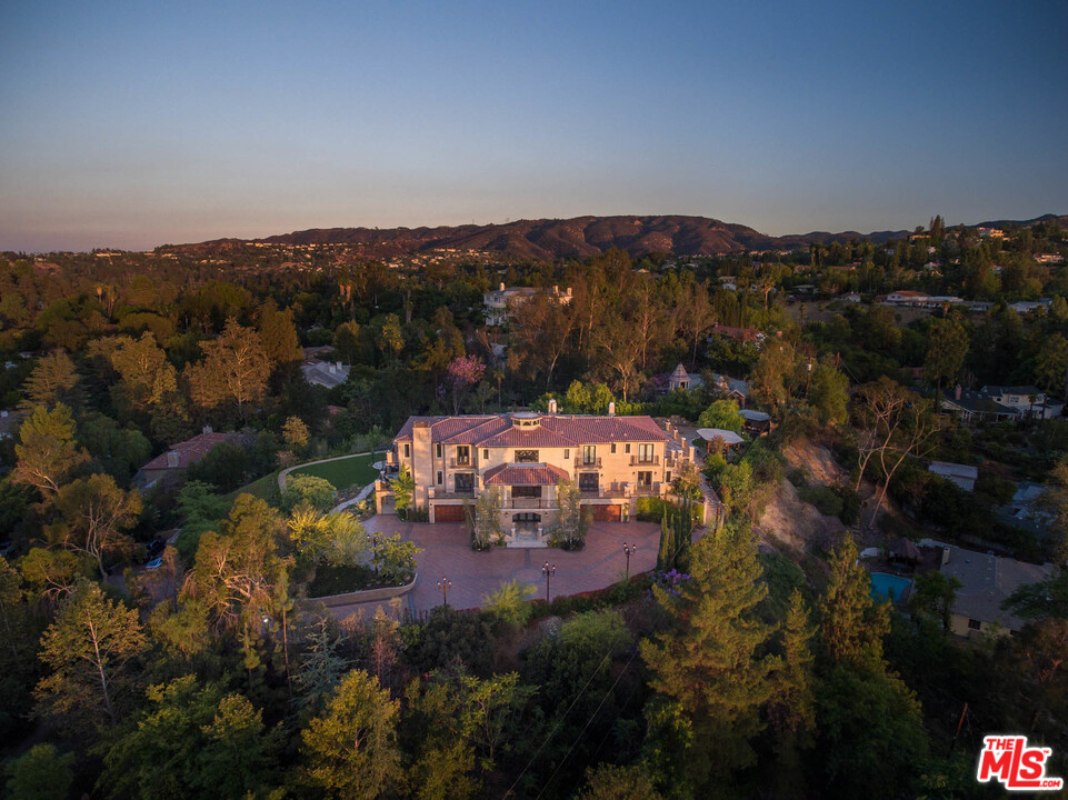 4775 Topeka Drive Tarzana, CA 91356 - Photo 3 of 19 an aerial view of a house with mountain view