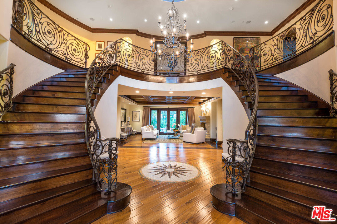 4775 Topeka Drive Tarzana, CA 91356 - Photo 4 of 19 a view of entryway and hall with wooden floor