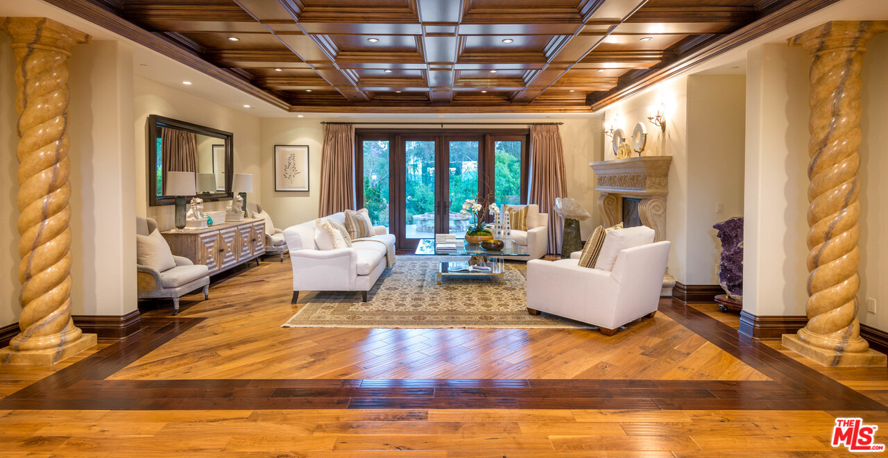 4775 Topeka Drive Tarzana, CA 91356 - Photo 5 of 19 a living room with furniture and a large window
