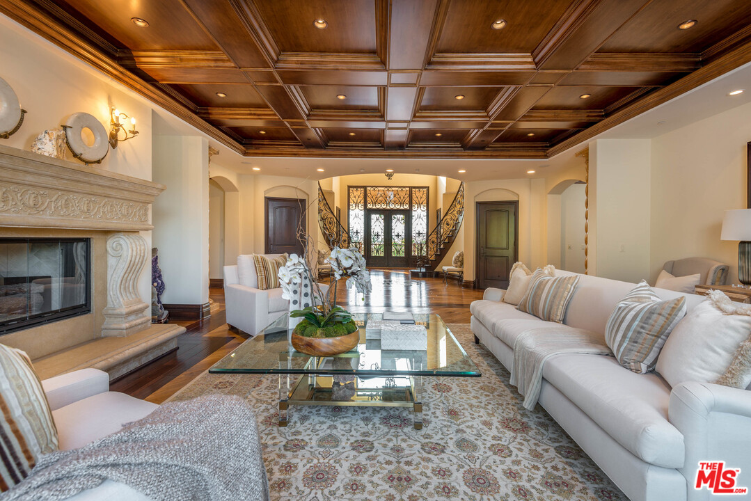 4775 Topeka Drive Tarzana, CA 91356 - Photo 6 of 19 a living room with furniture and a fireplace