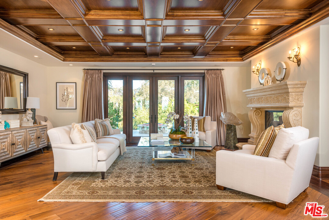 4775 Topeka Drive Tarzana, CA 91356 - Photo 7 of 19 a living room with furniture and a fireplace