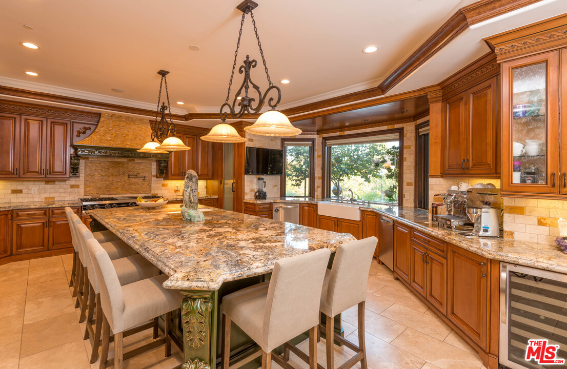 4775 Topeka Drive Tarzana, CA 91356 - Photo 8 of 19 a dining table with chairs and window