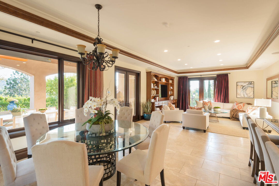 4775 Topeka Drive Tarzana, CA 91356 - Photo 9 of 19 a living room with furniture large window and furniture