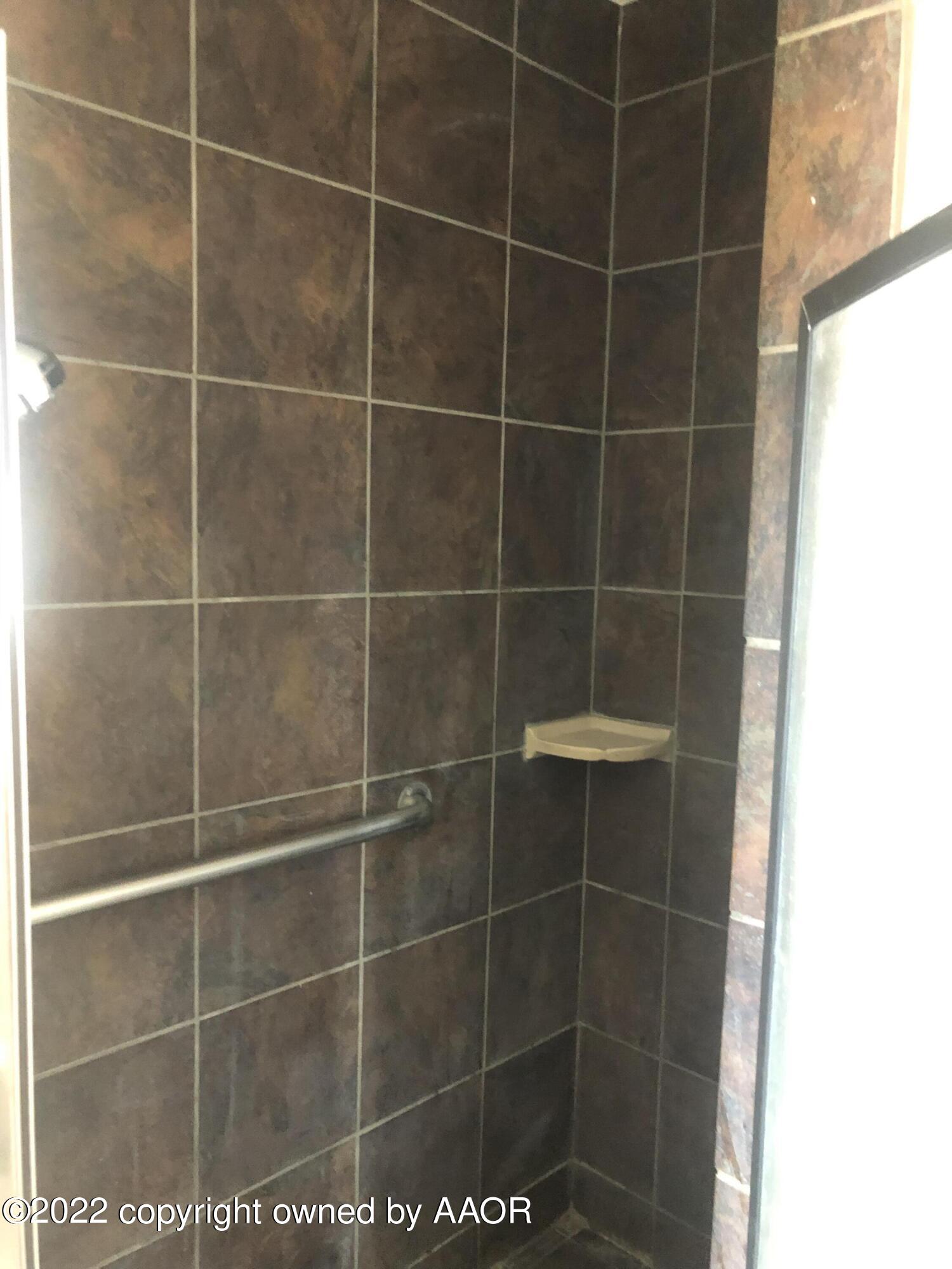 4110 South Polk Street Amarillo, TX 79110 - Photo 9 of 13 a bathroom with a shower