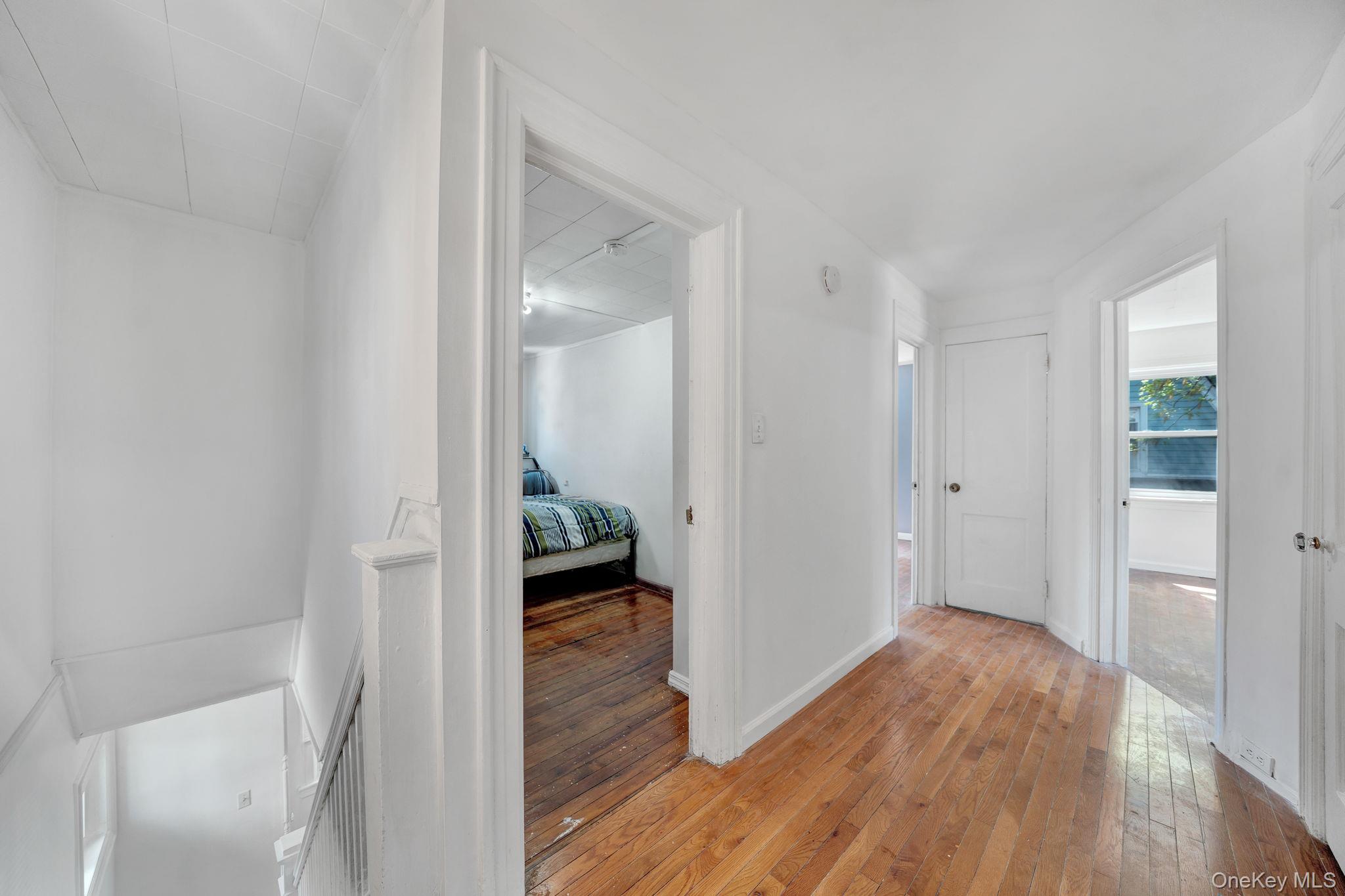 295 Washington Street Hempstead, NY 11550 - Photo 9 of 17 a view of a bathroom from a hallway