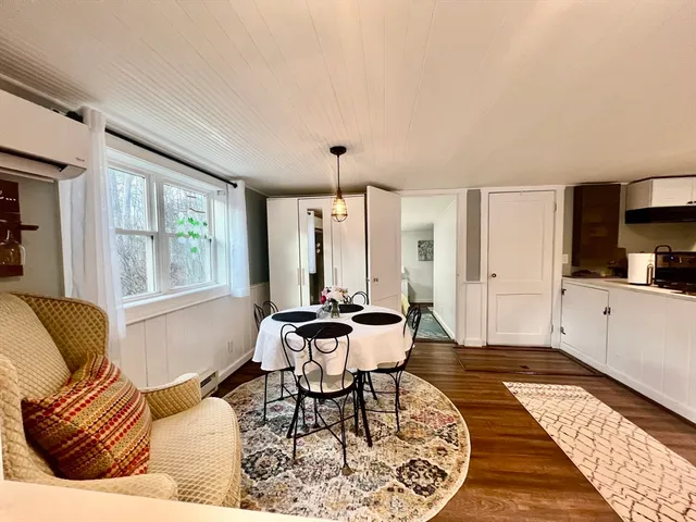 a living room with furniture and large windows