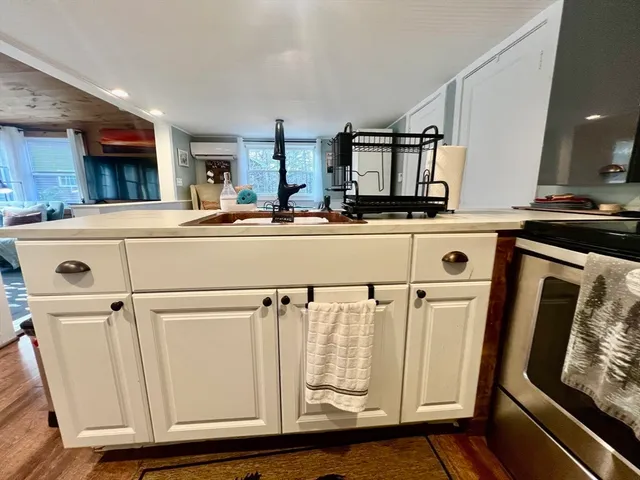 a kitchen with stainless steel appliances granite countertop a refrigerator and a stove