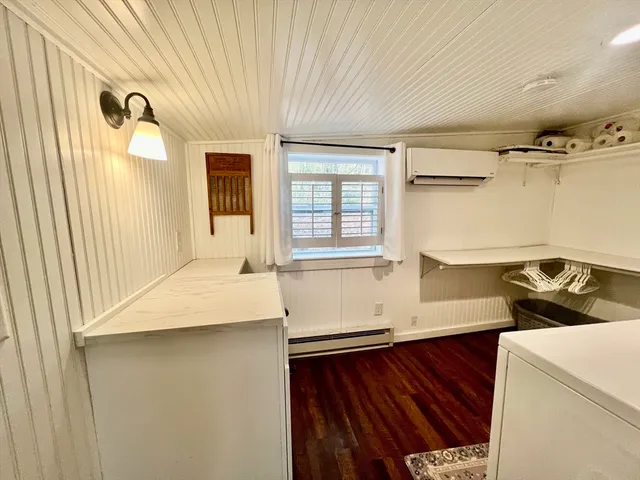 a kitchen with a sink and a refrigerator