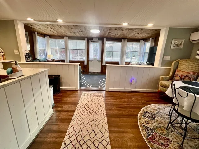 a view of kitchen with sink and wooden floor