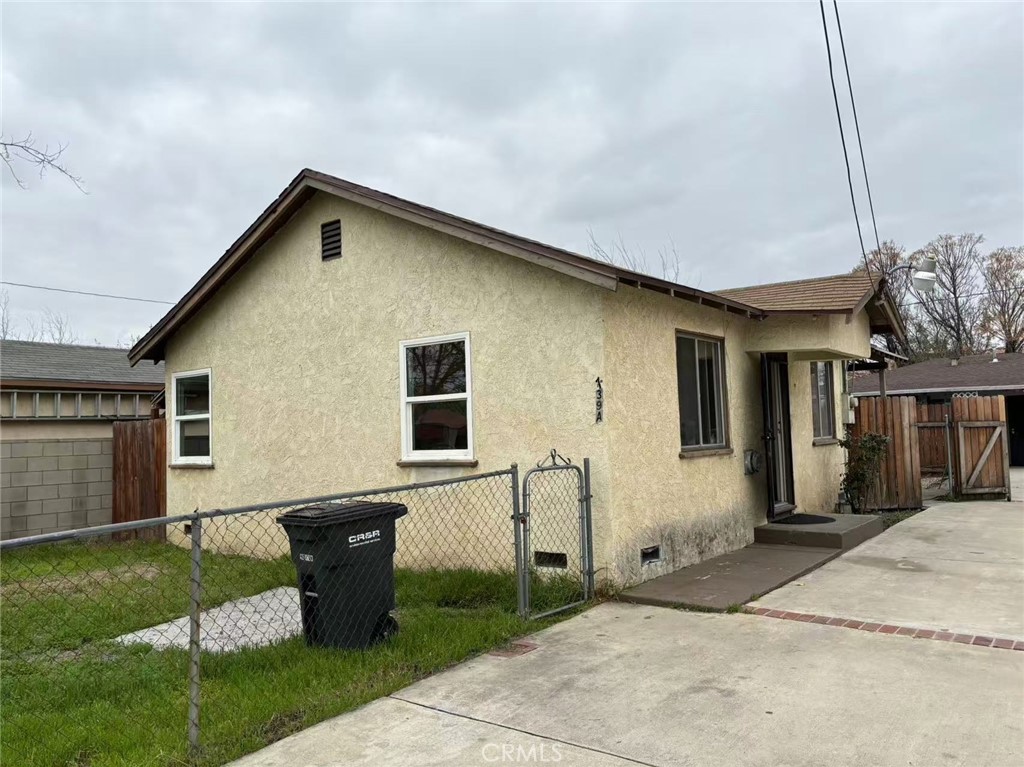 739 East Olive Street, Unit A Colton, CA 92324 - Photo 1 of 6 a backyard of a house with table and chairs