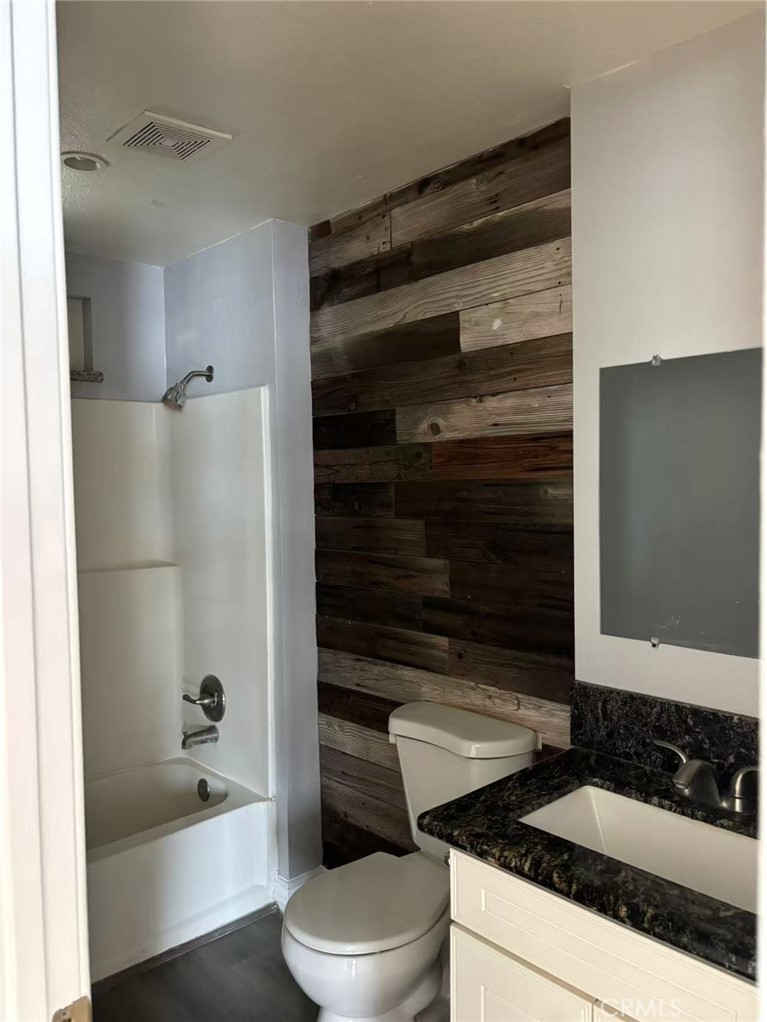 739 East Olive Street, Unit A Colton, CA 92324 - Photo 6 of 6 a bathroom with a bathtub and a shower