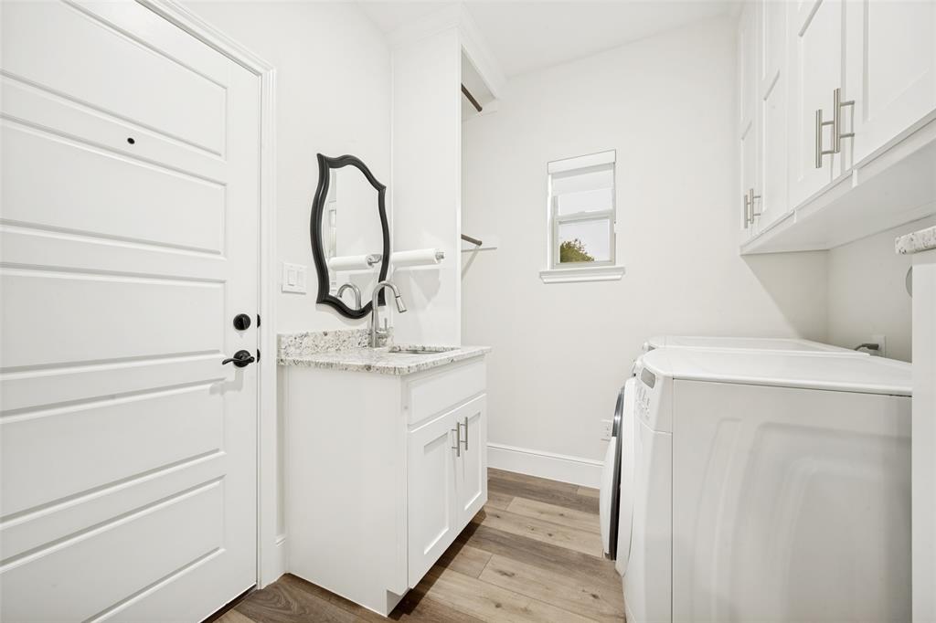 444 Ben Boyd Road Argyle, TX 76226 - Photo 23 of 28 a bathroom with a granite countertop sink and a mirror