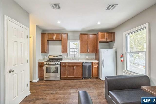 541 Union Avenue Paterson, NJ 07522 - Photo 20 of 28 a kitchen with granite countertop a refrigerator stove top oven and sink