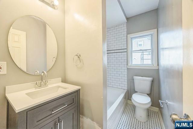 541 Union Avenue Paterson, NJ 07522 - Photo 22 of 28 a bathroom with a sink toilet and a mirror