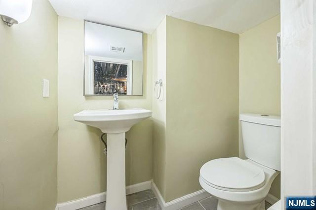 541 Union Avenue Paterson, NJ 07522 - Photo 26 of 28 a bathroom with a sink toilet and a mirror