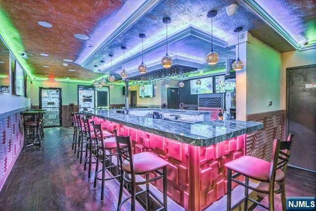 541 Union Avenue Paterson, NJ 07522 - Photo 10 of 28 a patio with a dinning table and chairs with a barbeque