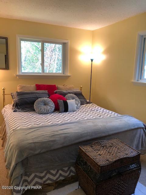 1547 Clover Road North Long Pond, PA 18334 - Photo 8 of 21 a bedroom with a bed and window