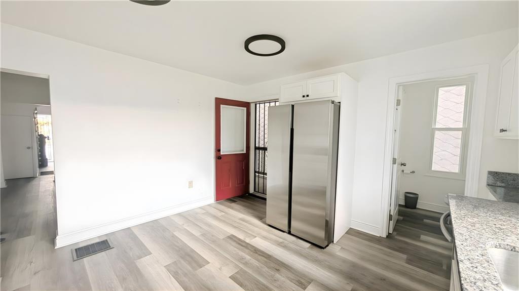 735 Boquet Street McKees Rocks, PA 15136 - Photo 11 of 30 a view of a livingroom with wooden floor and staircase