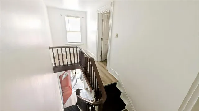 a view of entryway with wooden floor