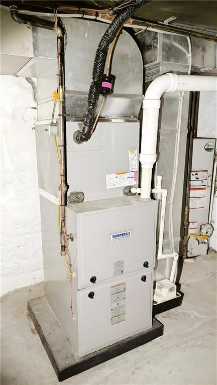 735 Boquet Street McKees Rocks, PA 15136 - Photo 26 of 30 a view of walk in closet with clothes and shoes