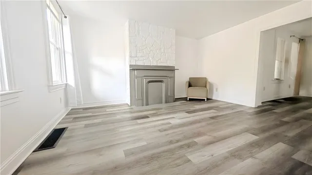 a view of a livingroom with furniture and cabinet