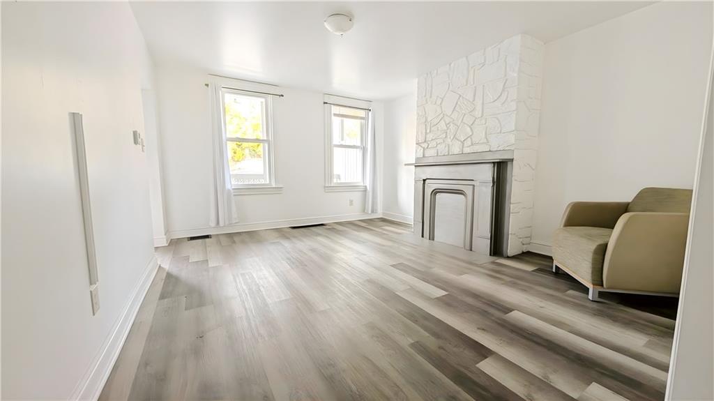 735 Boquet Street McKees Rocks, PA 15136 - Photo 6 of 30 a view of a livingroom with furniture wooden floor and window
