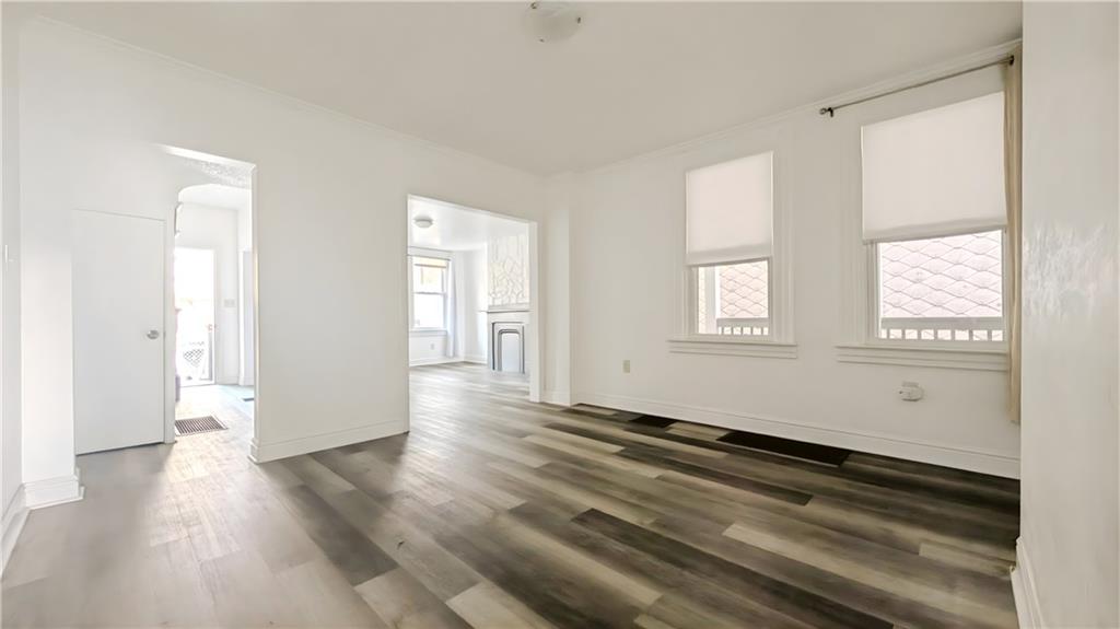 735 Boquet Street McKees Rocks, PA 15136 - Photo 8 of 30 a view of a room with wooden floor and windows