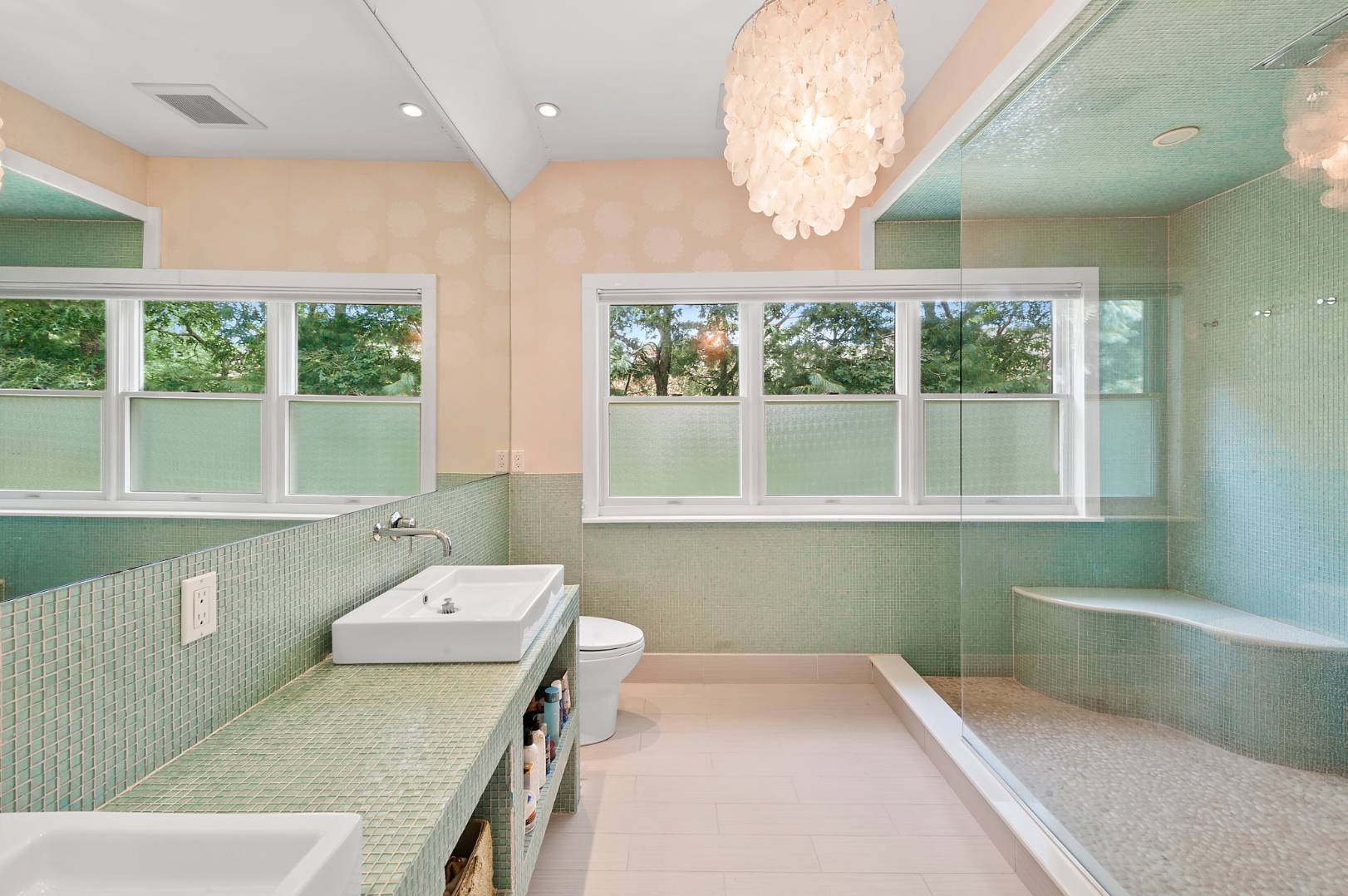 25 East Gate Road Wainscott, NY 11975 - Photo 7 of 13 a bathroom with a granite countertop sink and a large mirror