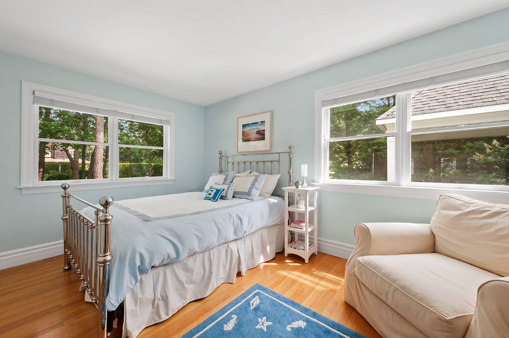 25 East Gate Road Wainscott, NY 11975 - Photo 9 of 13 a bedroom with a bed and a large window