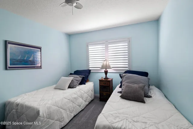 a bathroom with double sink and a mirror